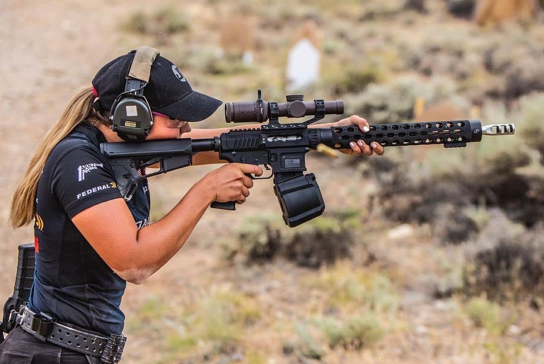 Competitive shooter firing a JP rifle on the range