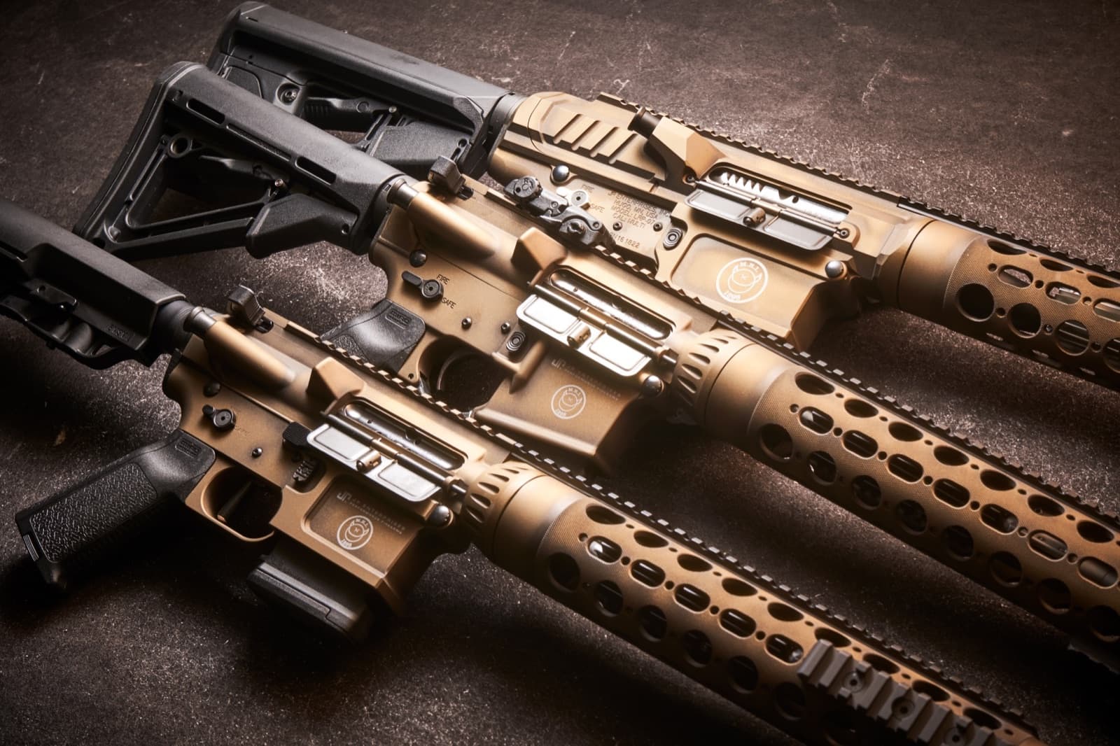 Two custom FDE JP rifles